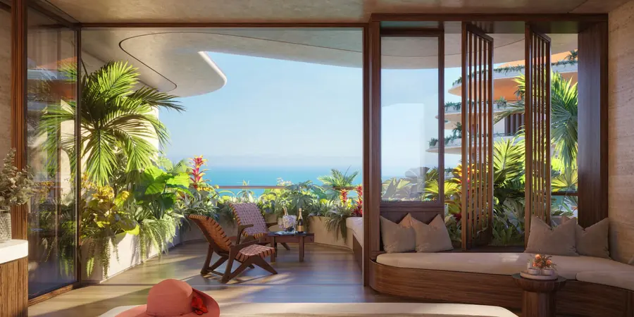 Living integrado à varanda curva com vista para a Praia Brava
