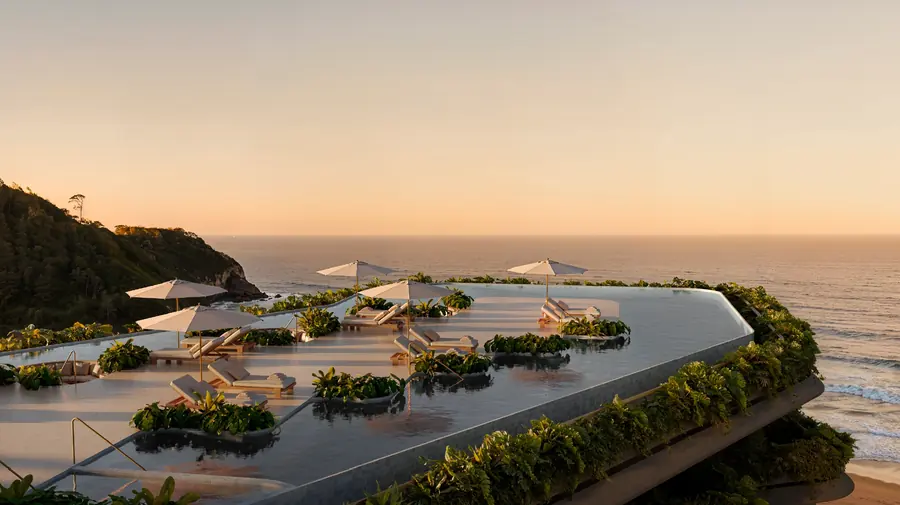Rooftop com piscina ao pôr do sol, de frente para o mar